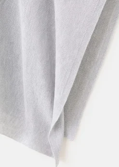 Asymmetrical knitted cape