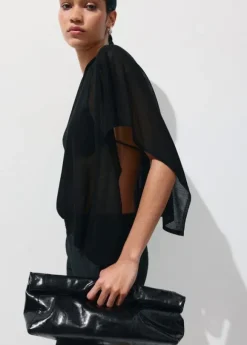 Asymmetrical knitted cape