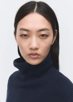 Sweater with asymmetrical roll neck
