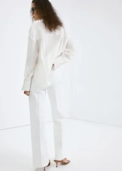Wide-leg jeans with side buttons
