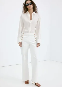 Wide-leg jeans with side buttons